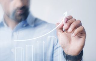 Man giving a business presentation using a high technology digit